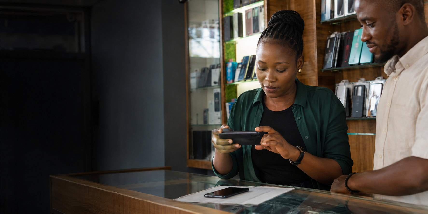 Virify Africa field agent documenting a smartphone at an electronics shop